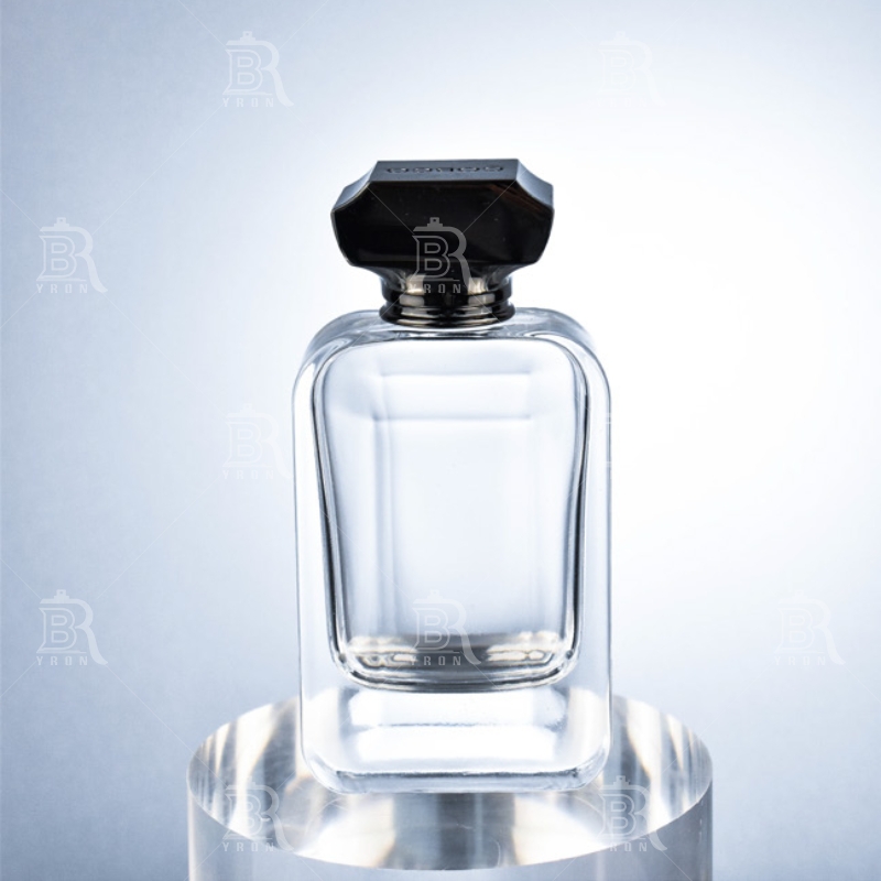 Luxury 100ml Perfume Glass Bottle with Gold Atomizer for High-End Brand Packaging